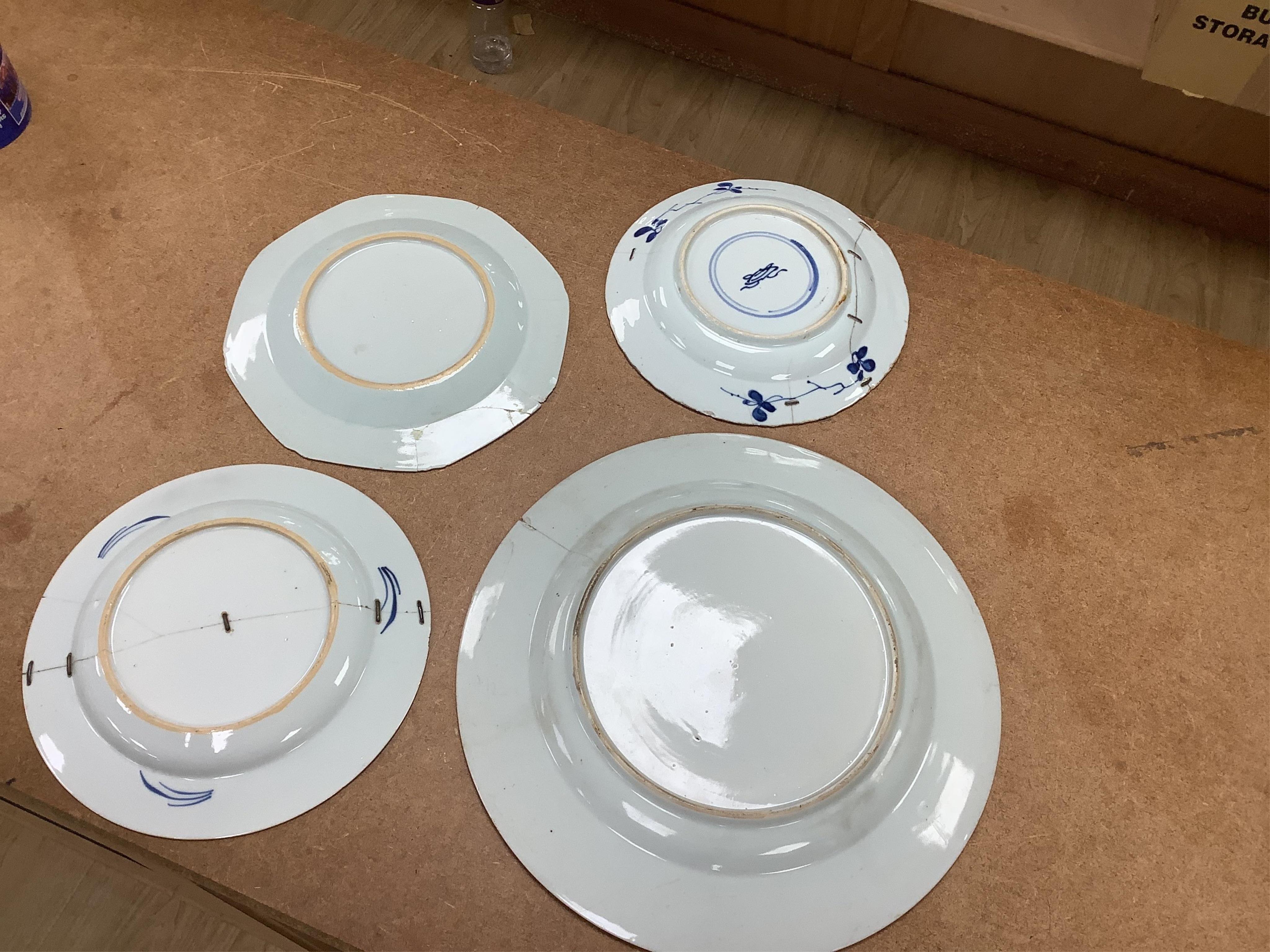 Six 18th century Chinese export blue and white plates, largest 32cm diameter. Condition - poor to fair